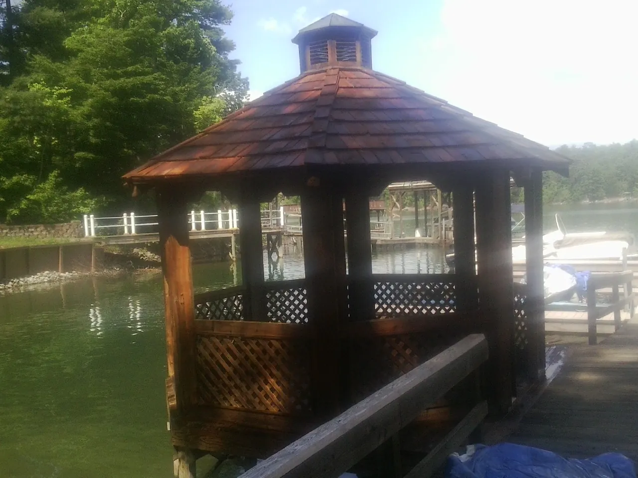 Cedar shake gazebo roof rebuilt on a lake dock in Pasco
